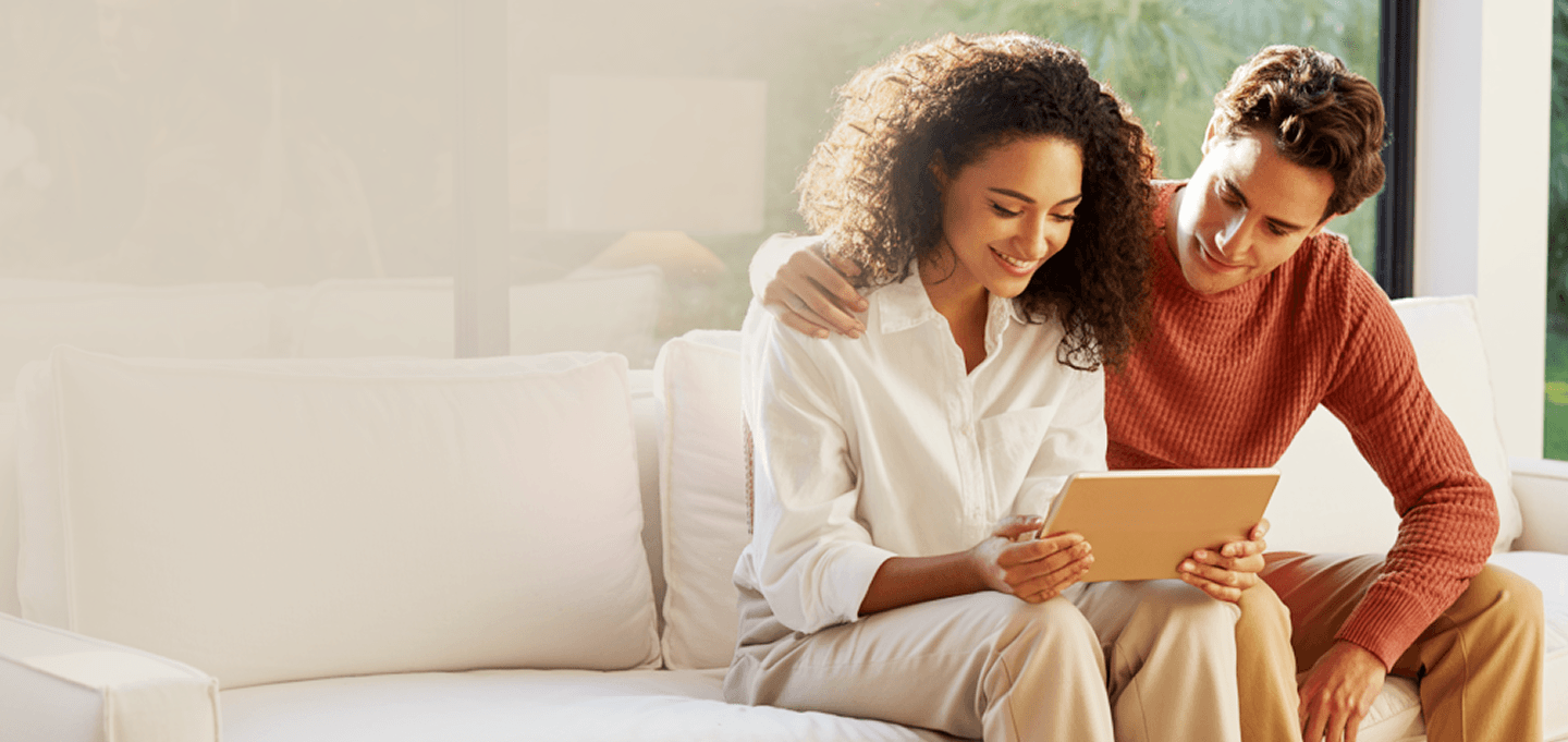 Couple looking at tablet together planning finances